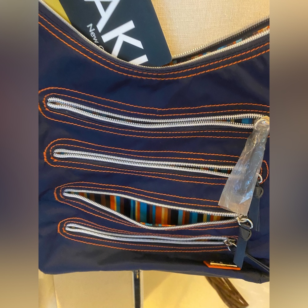 HADAKI purse New Orleans Navy Blue with orange accented striped pockets - Picture 2 of 11
